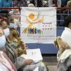 Une banderole sur laquelle est écrit “Synode 2021-2023” est accrochée dans l'assemblée, lors de la célébration de la messe chrismale au Palais des sports de la ville de Créteil. Créteil, 12 avril 2022. © Corinne SIMON / Hans Lucas.