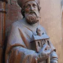 Saint Genès - Statue en bois de Saint-Genès au portail méridional de l'église Saint-Genès des Carmes de Clermont-Ferrand © Wikipedia