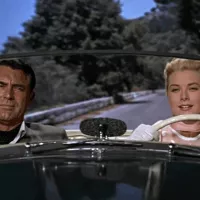 © Paramount Pictures. Cary Grant et Grace Kelly dans La Main au collet en 1955.