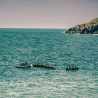 Migrants sur des bateaux. ©Unsplash