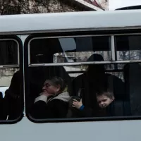 Réfugiés ukrainiens dans un bus. ©Unsplash