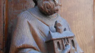 Saint Genès - Statue en bois de Saint-Genès au portail méridional de l'église Saint-Genès des Carmes de Clermont-Ferrand © Wikipedia