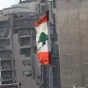 Drapeau libanais flottant sur un immeuble de Beyrouth/Amélie Gazeau/RCF